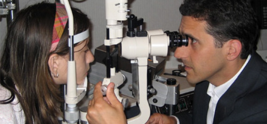 Dr. Louis Furlan examines young child.